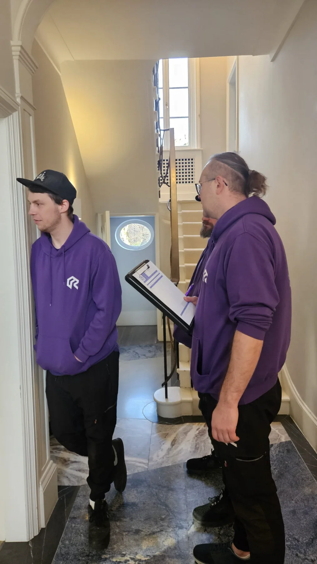 Rad Removals packing team reviewing an inventory checklist before starting a house move in London